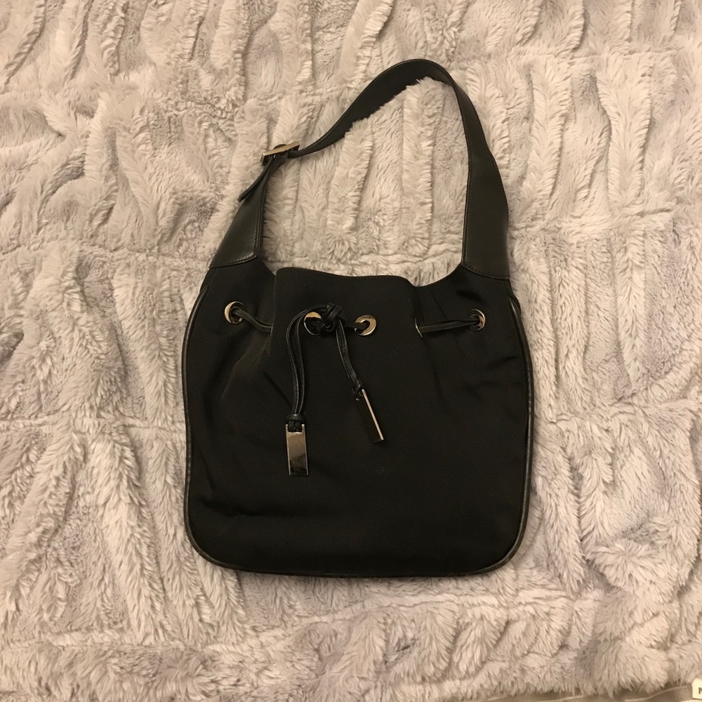 Black Gucci bag with tassels